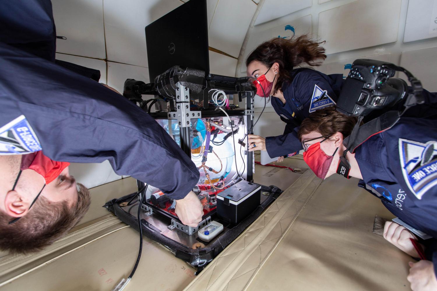 Members of the BETVLCTOR伟德登录 Microgravity Team conduct research aboard NASA's zero g aircraft.